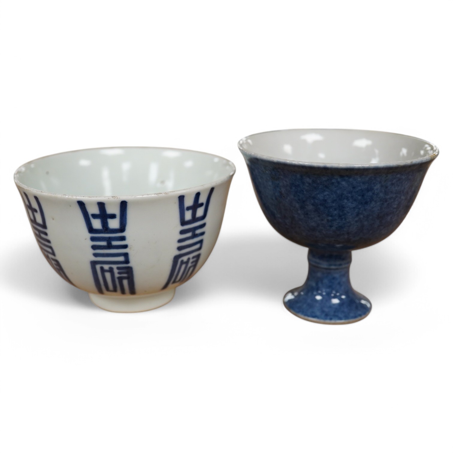 A Chinese powder blue stem cup and a blue and white 'shou' cup, largest 10cm in diameter. Condition - good